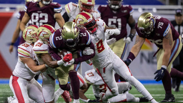 Michigan Panthers' Stevie Scott ll (2) is tackled by three defenders during a game against the Birmingham Stallions at Ford Field in Detroit on Saturday, May 20, 2023.  